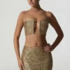 Top corto con cut-out decorato Ariana in oro Top corto con cut-out decorato Ariana in oro