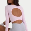 Top corto con cut-out in tessuto a costine morbido senza cuciture in rosa cipria Top corto con cut-out in tessuto a costine morbido senza cuciture in rosa cipria