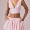 Top corto con fiocco Magda a righe color malva chiaro Top corto con fiocco Magda a righe color malva chiaro