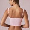 Top corto con fiocco Magda a righe color malva chiaro Top corto con fiocco Magda a righe color malva chiaro