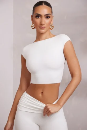 Top corto con maniche ad aletta e schiena scoperta Juno in bianco