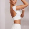 Top corto con maniche ad aletta e schiena scoperta Juno in bianco Top corto con maniche ad aletta e schiena scoperta Juno in bianco