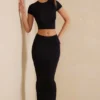 Top corto con maniche ad aletta Myaree in nero Top corto con maniche ad aletta Myaree in nero