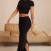 Top corto con maniche ad aletta Myaree in nero Top corto con maniche ad aletta Myaree in nero