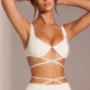 Top corto con spalline e ferretto decorato Parma in bianco Top corto con spalline e ferretto decorato Parma in bianco