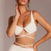 Top corto con spalline e ferretto decorato Parma in bianco Top corto con spalline e ferretto decorato Parma in bianco