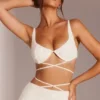 Top corto con spalline e ferretto decorato Parma in bianco Top corto con spalline e ferretto decorato Parma in bianco