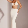 Top corto con spalline e ferretto decorato Parma in bianco Top corto con spalline e ferretto decorato Parma in bianco