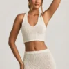 Top corto Gianna Bouclé con scollo all’americana in bianco Top corto Gianna Bouclé con scollo all’americana in bianco