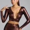 Top corto in jersey metallizzato con scollo a V Rana in rame bronzo Top corto in jersey metallizzato con scollo a V Rana in rame bronzo