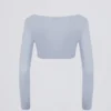 Top corto in jersey spazzolato con scollo a V in blu tenue Top corto in jersey spazzolato con scollo a V in blu tenue