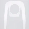 Top corto senza cuciture a costine morbide con cut-out in bianco Top corto senza cuciture a costine morbide con cut-out in bianco
