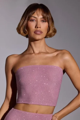 Top corto senza spalline decorato Odetta in rosa chiaro Top corto senza spalline decorato Odetta in rosa chiaro
