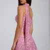Top Cosette con dettagli asimmetrici e sciarpa decorativa in rosa Top Cosette con dettagli asimmetrici e sciarpa decorativa in rosa