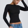 Top Elli in modal con collo alto, maniche lunghe e schiena scoperta, colore nero Top Elli in modal con collo alto, maniche lunghe e schiena scoperta, colore nero
