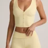 Top gilet con bottoni a costine in modal Lene, colore giallo crema Top gilet con bottoni a costine in modal Lene, colore giallo crema