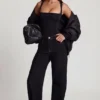 Top in jersey morbido con scollo quadrato e arricciature Mirandria in nero Top in jersey morbido con scollo quadrato e arricciature Mirandria in nero