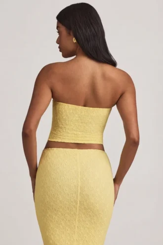 Top in pizzo senza spalline con arricciature Tamia in giallo pastello