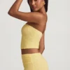 Top in pizzo senza spalline con arricciature Tamia in giallo pastello Top in pizzo senza spalline con arricciature Tamia in giallo pastello