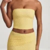 Top in pizzo senza spalline con arricciature Tamia in giallo pastello Top in pizzo senza spalline con arricciature Tamia in giallo pastello