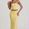 Top in pizzo senza spalline con arricciature Tamia in giallo pastello Top in pizzo senza spalline con arricciature Tamia in giallo pastello