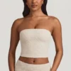 Top in pizzo senza spalline con ruches Tamia in avorio Top in pizzo senza spalline con ruches Tamia in avorio
