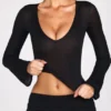 Top Liah in jersey trasparente con scollo profondo e maniche lunghe, colore nero Top Liah in jersey trasparente con scollo profondo e maniche lunghe, colore nero
