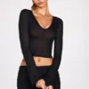 Top Liah in jersey trasparente con scollo profondo e maniche lunghe, colore nero Top Liah in jersey trasparente con scollo profondo e maniche lunghe, colore nero