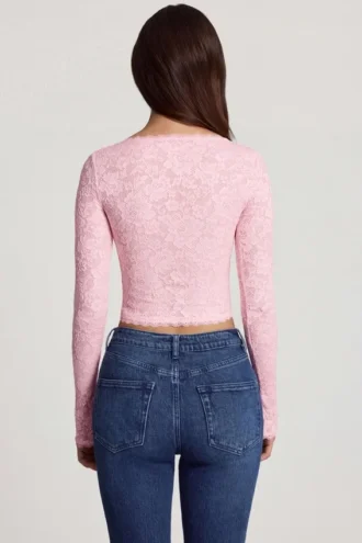 Top Lioren in pizzo trasparente con scollo profondo e maniche lunghe, colore rosa