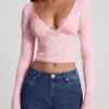 Top Lioren in pizzo trasparente con scollo profondo e maniche lunghe, colore rosa Top Lioren in pizzo trasparente con scollo profondo e maniche lunghe, colore rosa