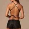 Top Maris con lacci sul retro a forma di farfalla in nero Top Maris con lacci sul retro a forma di farfalla in nero