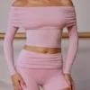 Top trasparente con spalle scoperte e maniche lunghe in rosa tenue Top trasparente con spalle scoperte e maniche lunghe in rosa tenue