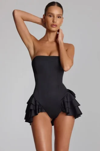 Tuta Corte con corsetto allacciato e volant Priaska in nero