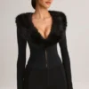 Tuta Corte con corsetto e bordi in pelliccia sintetica Nesta in nero Tuta Corte con corsetto e bordi in pelliccia sintetica Nesta in nero