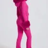 Tuta da sci aderente con cappuccio in pelliccia sintetica impermeabile in rosa magenta Tuta da sci aderente con cappuccio in pelliccia sintetica impermeabile in rosa magenta