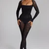 Tuta intera in maglia senza cuciture a maniche lunghe Irina in nero Tuta intera in maglia senza cuciture a maniche lunghe Irina in nero