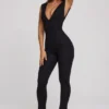 Tuta Intera Romana con scollo a V e vita arricciata in nero Tuta Intera Romana con scollo a V e vita arricciata in nero