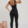 Tuta Intera Romana con scollo a V e vita arricciata in nero Tuta Intera Romana con scollo a V e vita arricciata in nero
