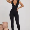 Tuta Intera Romana con scollo a V e vita arricciata in nero Tuta Intera Romana con scollo a V e vita arricciata in nero
