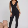 Tuta Intera Romana con scollo a V e vita arricciata in nero Tuta Intera Romana con scollo a V e vita arricciata in nero