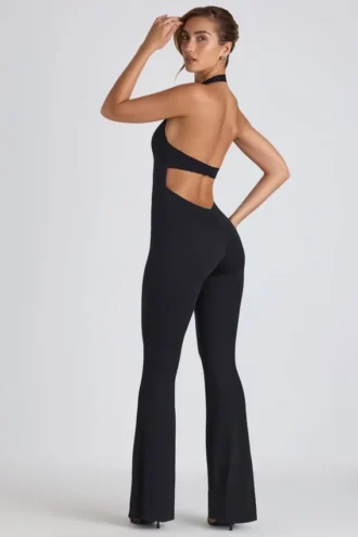 Tuta intera svasata con cut-out e bordi in pizzo Pema Modal in nero