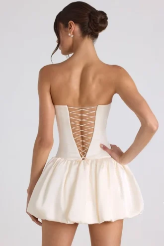 Vestito corto a corsetto con orlo a palloncino e allacciatura Fabiola in avorio
