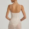 Vestito corto a corsetto drappeggiato con decorazioni semi-trasparenti Connie in bianco