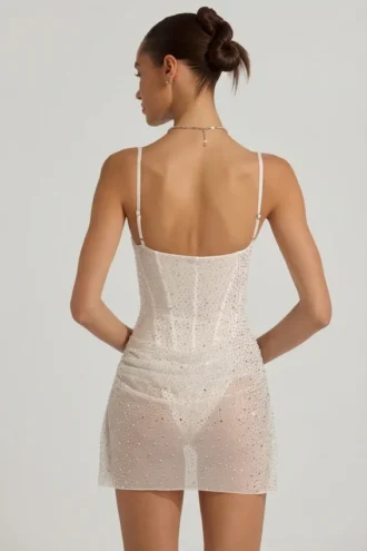 Vestito corto a corsetto drappeggiato con decorazioni semi-trasparenti Connie in bianco