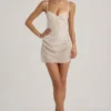 Vestito corto a corsetto drappeggiato con decorazioni semi-trasparenti Connie in bianco