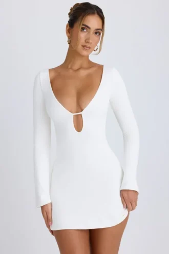 Vestito corto a maniche lunghe con cut-out Mavisa in bianco