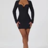 Vestito corto aderente con cut-out a forma di cuore Adelia in nero Vestito corto aderente con cut-out a forma di cuore Adelia in nero