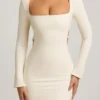 Vestito corto Akari con dettagli in perle e cut-out in avorio Vestito corto Akari con dettagli in perle e cut-out in avorio