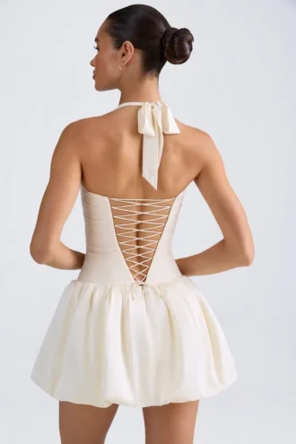 Vestito corto con corpetto allacciato con scollo all’americana e orlo a palloncino Ludmila in avorio