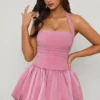 Vestito corto con corpetto allacciato sul collo all’americana e orlo a palloncino Ludmila in malva Vestito corto con corpetto allacciato sul collo all’americana e orlo a palloncino Ludmila in malva